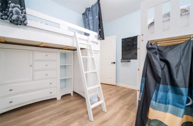 spacious closet with light hardwood / wood-style flooring