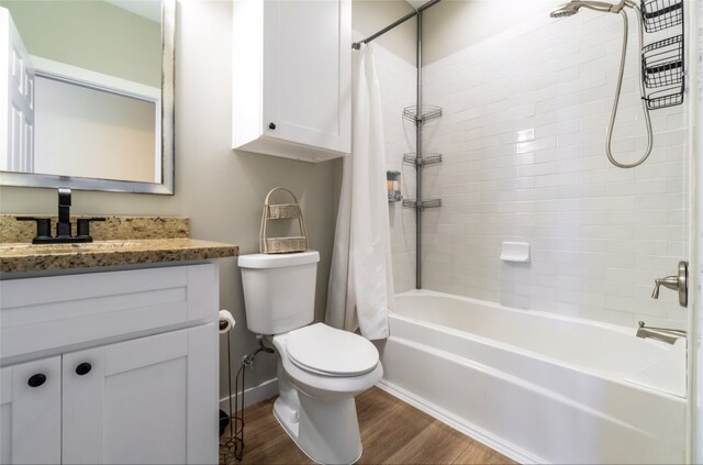 full bathroom with wood-type flooring, vanity, toilet, and shower / bath combo