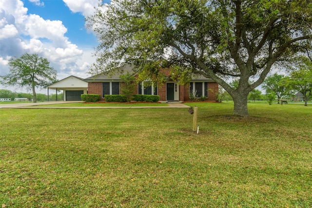 ranch-style home featuring a front lawn and a garage