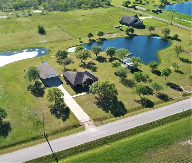 drone / aerial view with a rural view and a water view