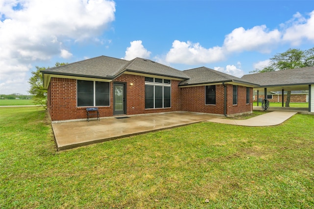 rear view of property with a patio area and a yard