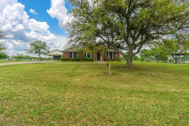 view of front facade featuring a garage and a front lawn