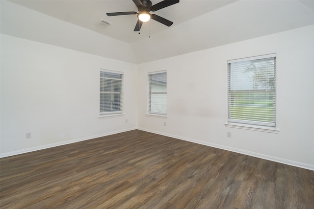 unfurnished room with vaulted ceiling, ceiling fan, and dark hardwood / wood-style flooring