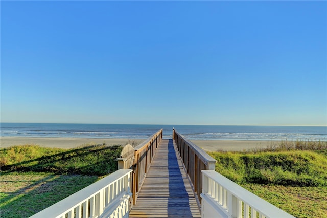 view of property's community featuring a view of the beach and a water view