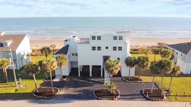 birds eye view of property featuring a view of the beach and a water view