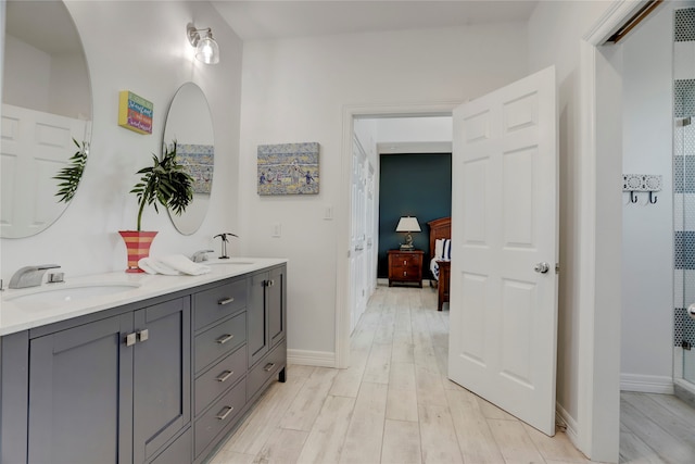 bathroom featuring hardwood / wood-style floors and vanity