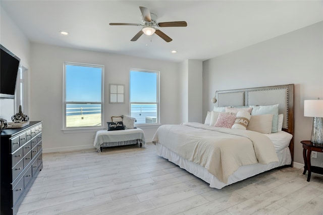 bedroom featuring ceiling fan and light hardwood / wood-style floors