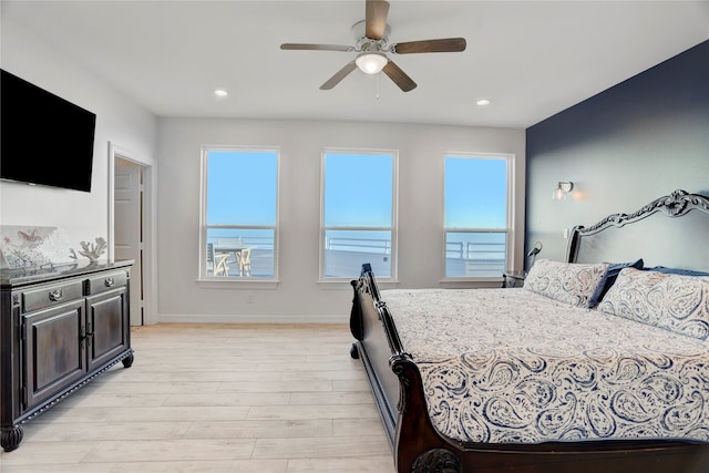 bedroom featuring light hardwood / wood-style floors and ceiling fan