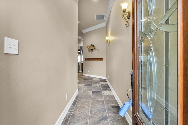 entryway featuring ornamental molding