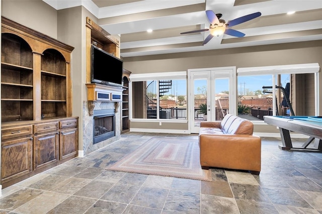 living room featuring pool table, a healthy amount of sunlight, ceiling fan, and crown molding