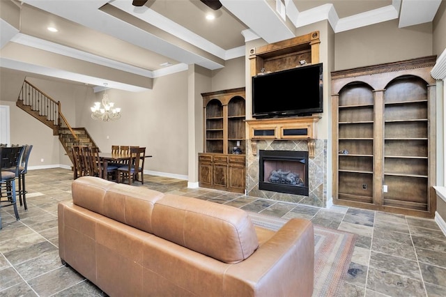 living room with a fireplace, crown molding, a chandelier, and beamed ceiling