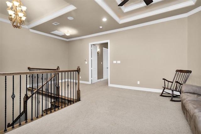 interior space with crown molding, carpet flooring, and a tray ceiling