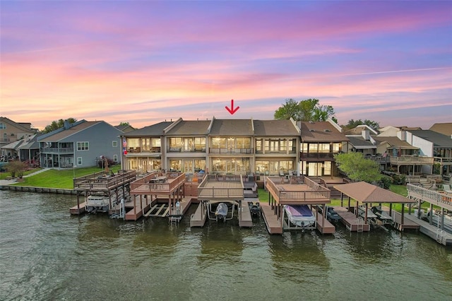 view of dock featuring a balcony and a water view