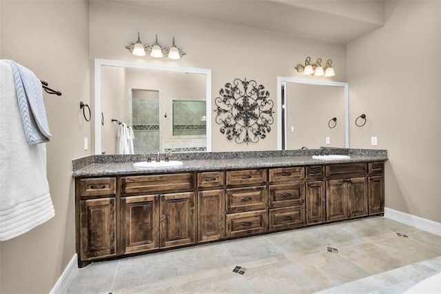 bathroom featuring tile patterned floors, walk in shower, and vanity