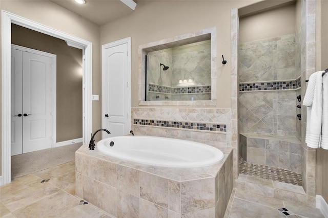 bathroom featuring independent shower and bath and tile patterned flooring