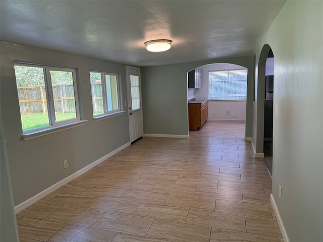 spare room featuring a textured ceiling