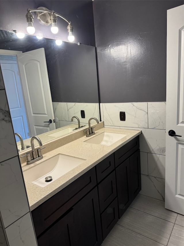 bathroom with tile walls and vanity