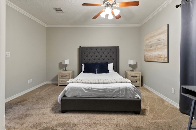 carpeted bedroom with ornamental molding, ceiling fan, and a textured ceiling