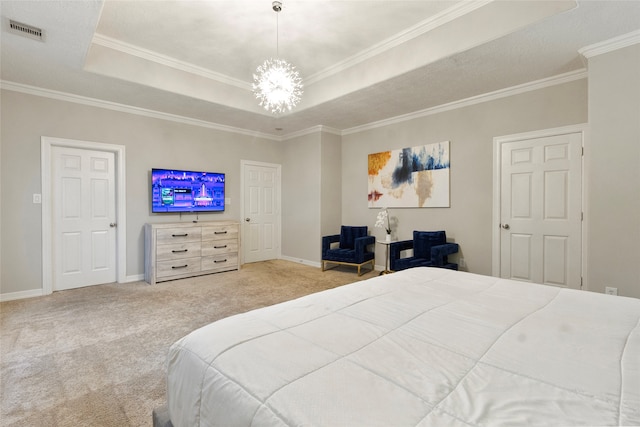 carpeted bedroom featuring a chandelier, a tray ceiling, and crown molding