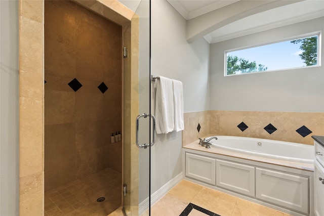 bathroom with plus walk in shower, ornamental molding, tile patterned floors, and vanity