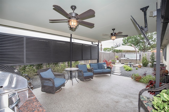 view of patio / terrace featuring outdoor lounge area and a hot tub