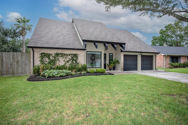 view of front facade with a front lawn and a garage