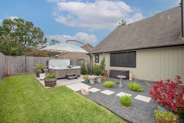 view of yard with a patio and a hot tub