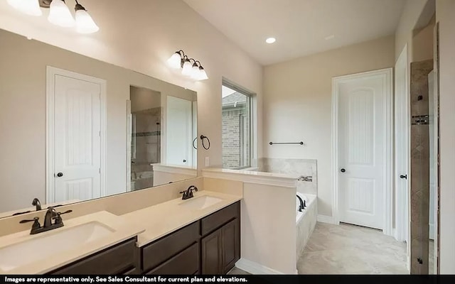 bathroom featuring vanity and shower with separate bathtub