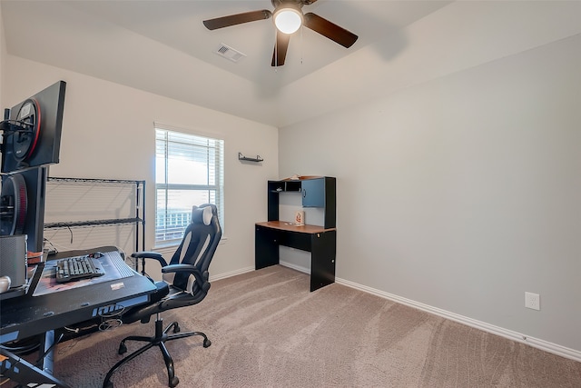 carpeted home office featuring ceiling fan