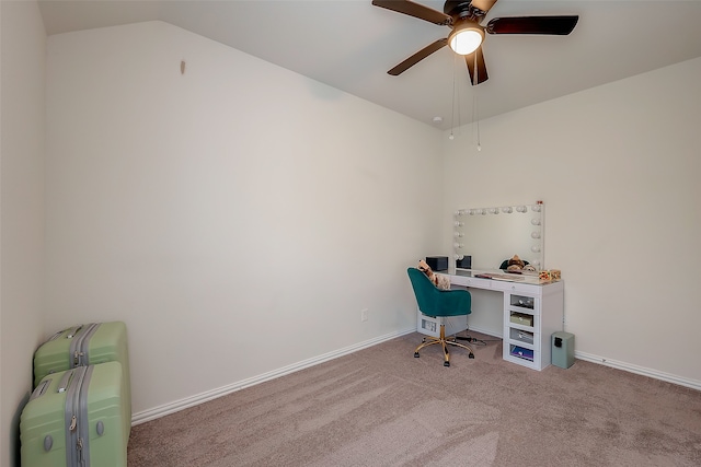 office area with vaulted ceiling, ceiling fan, and light colored carpet