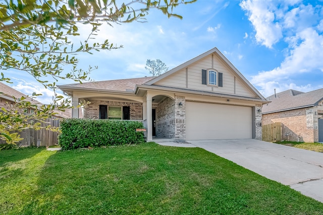 view of front of home featuring a garage and a front yard