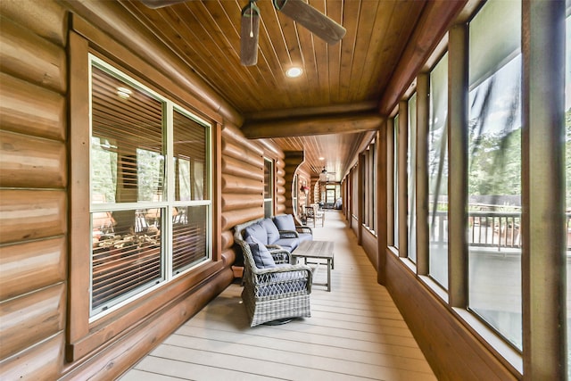 sunroom featuring wood ceiling