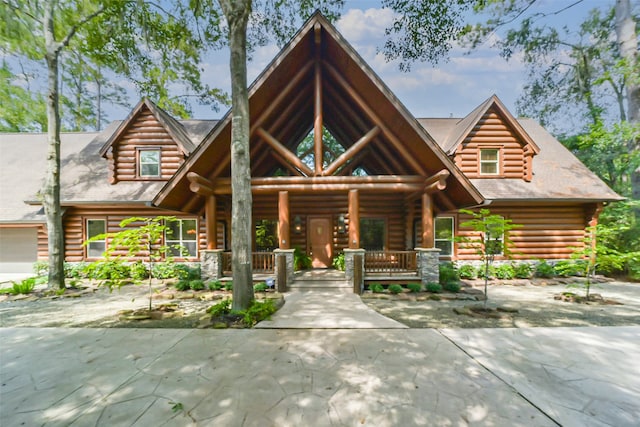 cabin featuring covered porch