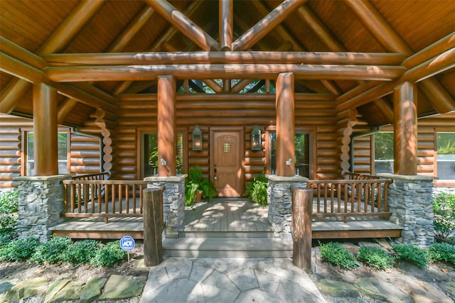 view of exterior entry featuring a porch