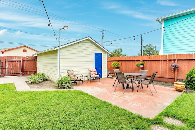 view of patio / terrace featuring an outbuilding