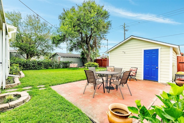 view of patio / terrace with an outbuilding