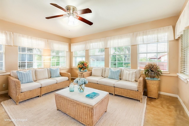 sunroom featuring a wealth of natural light and ceiling fan