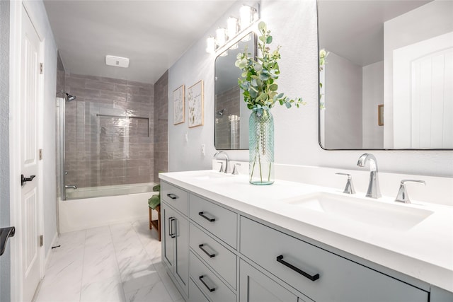 bathroom with vanity and tiled shower / bath