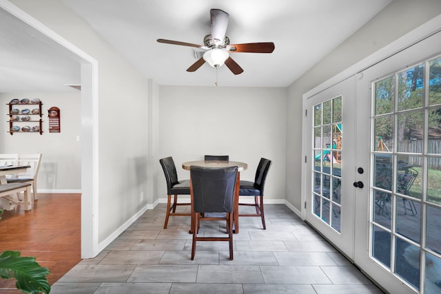 dining area with light wood-type flooring, ceiling fan, and french doors