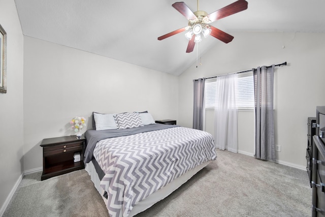 carpeted bedroom featuring vaulted ceiling and ceiling fan