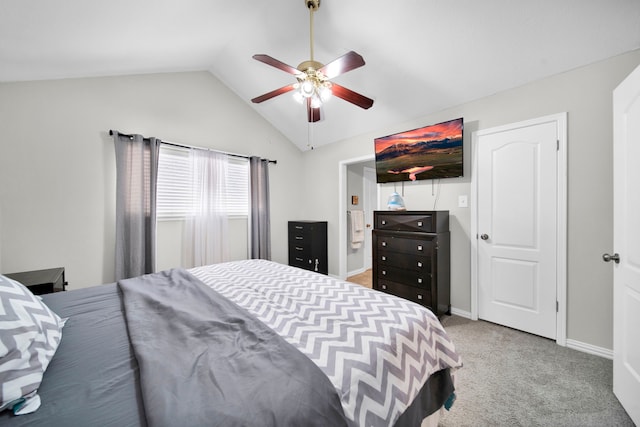 bedroom featuring vaulted ceiling, ceiling fan, and light colored carpet