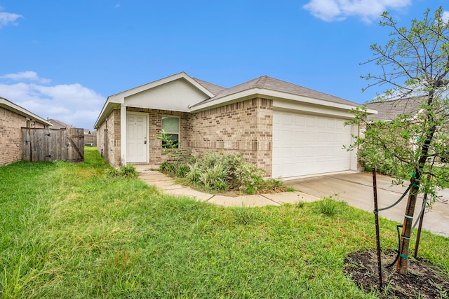 single story home featuring a front yard and a garage