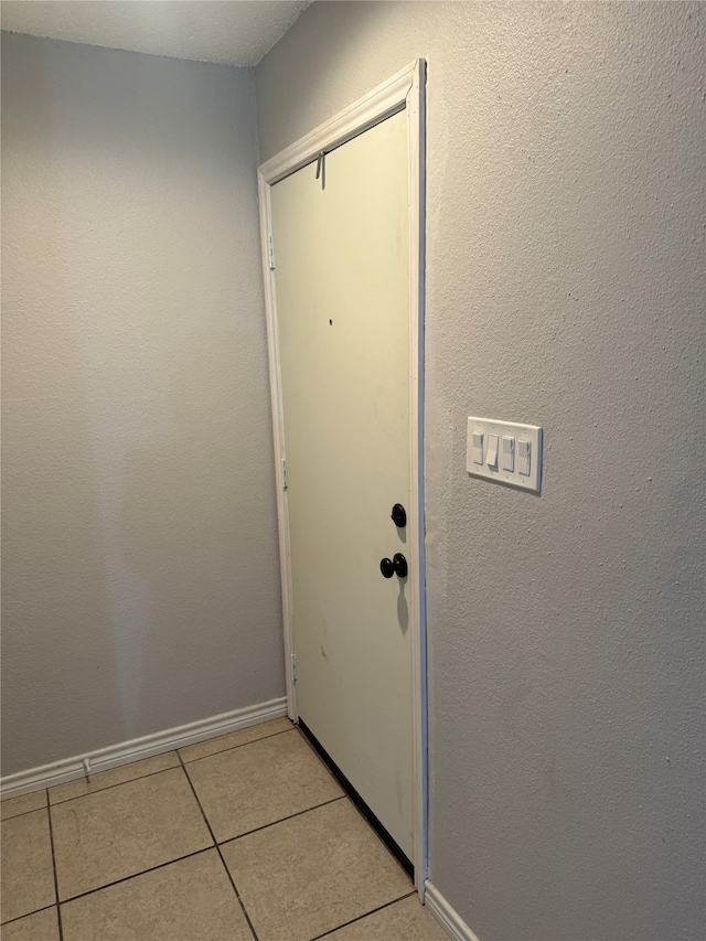 doorway featuring light tile patterned floors