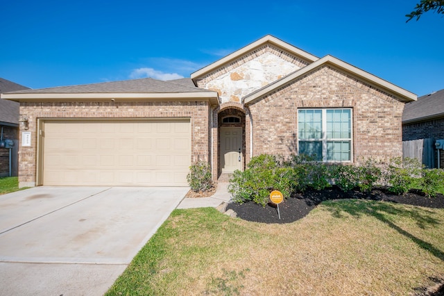 ranch-style house featuring a garage and a front yard