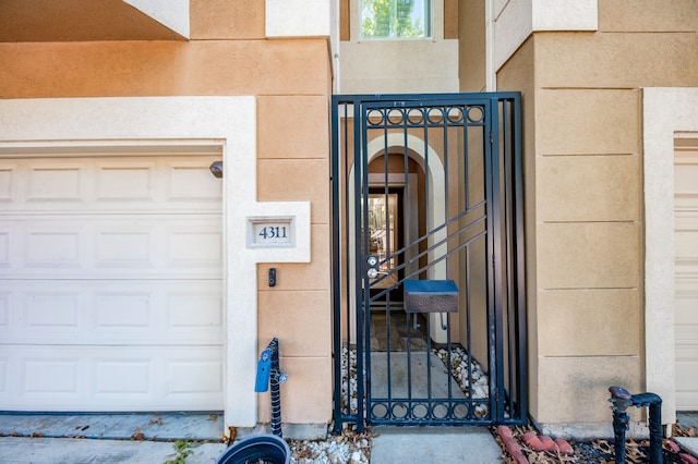 property entrance with a garage