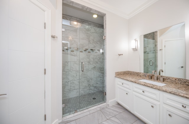 bathroom with ornamental molding, an enclosed shower, and vanity