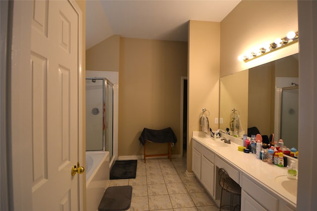 bathroom featuring lofted ceiling, vanity, and separate shower and tub