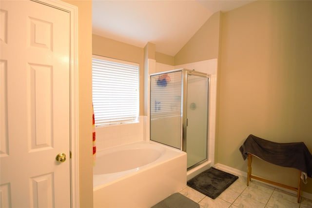 bathroom featuring vaulted ceiling, tile patterned floors, and separate shower and tub