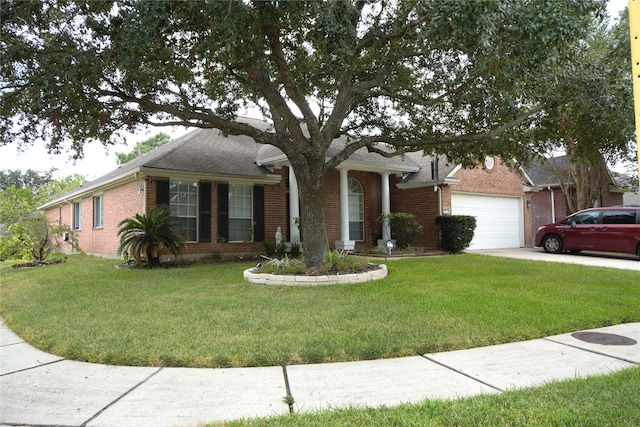 single story home featuring a garage and a front yard