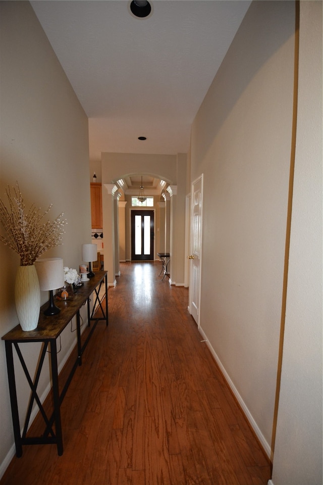 hallway with dark hardwood / wood-style flooring